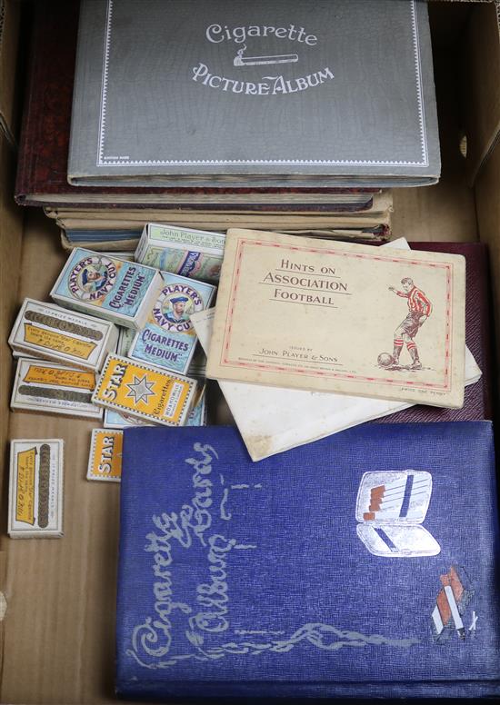 A collection of cigarette cards in 9 albums and packets